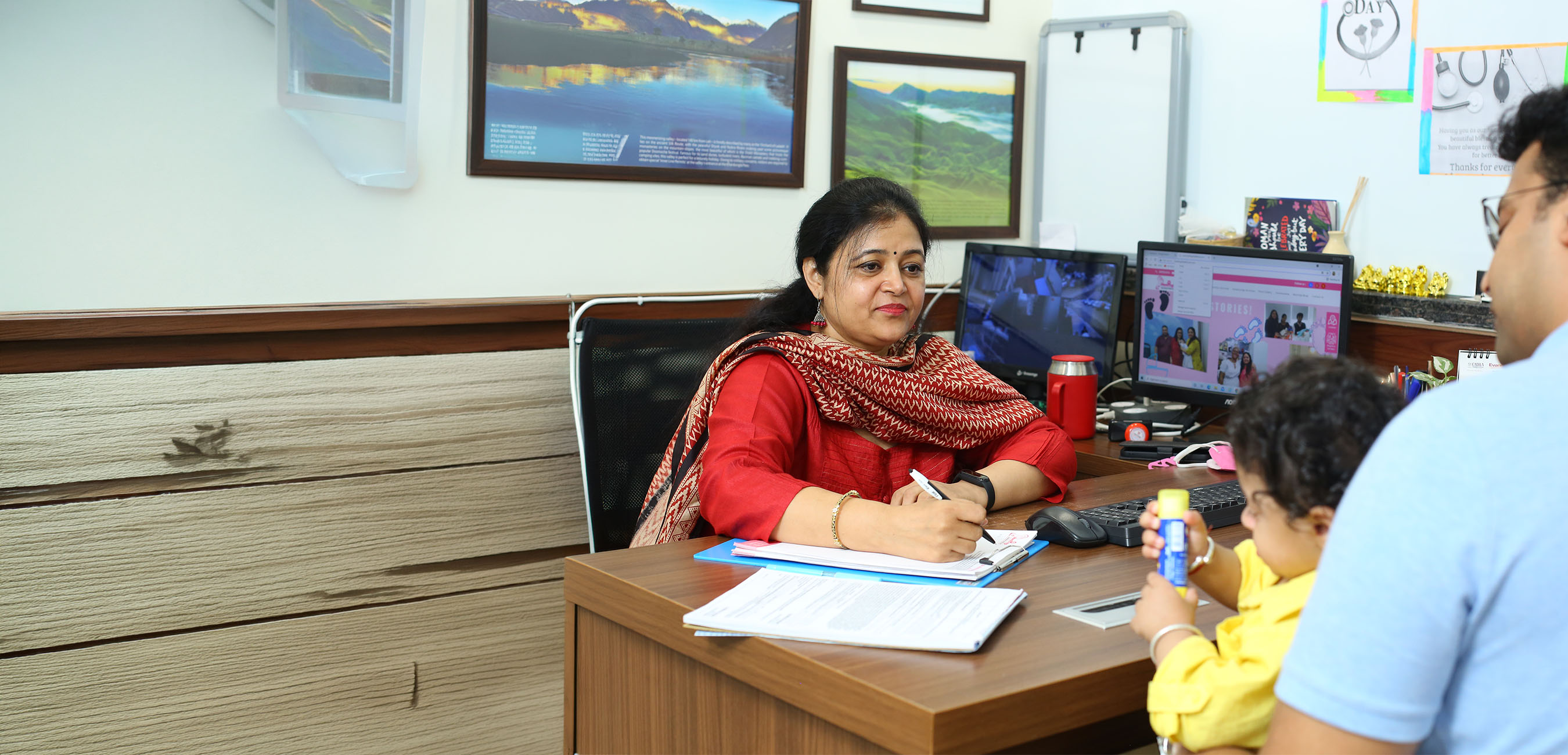 Happy parents holding new born baby